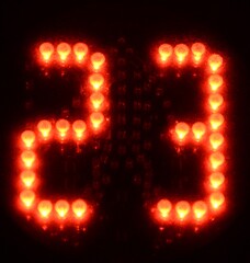 Fondo con detalle de numero 23 en led de color rojo