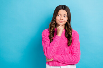 Photo of young charming unsure minded thinking look empty space advertisement touch chin choose...