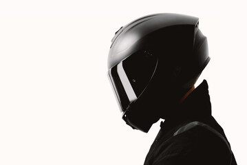 Portrait of a motorcycle rider posing with a black helmet on a white background. - 552455293