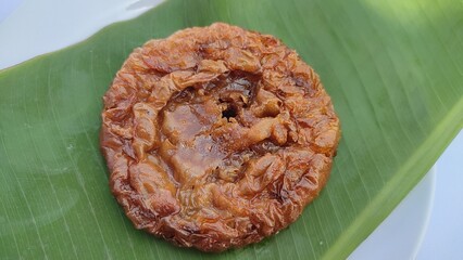 A bite of kue Cucur or Bowsprit cake with white background.
