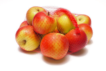 The heap of apples packaged in the red net