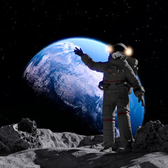 Fototapeta na wymiar Astronaut on the Moon and in the background the planet Earth
