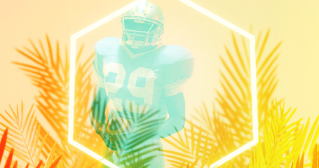 Composite of american football player standing by illuminated hexagon and plants on beige background