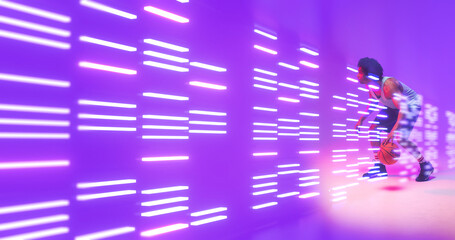 Composite of biracial basketball player dribbling by illuminated lights on purple background