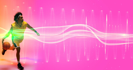 Naklejka premium Biracial player dribbling basketball over illuminated wave and zig zag pattern on pink background