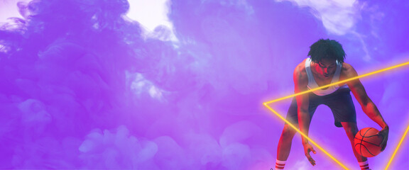 Composite of biracial male basketball player dribbling ball by triangle over smoky background