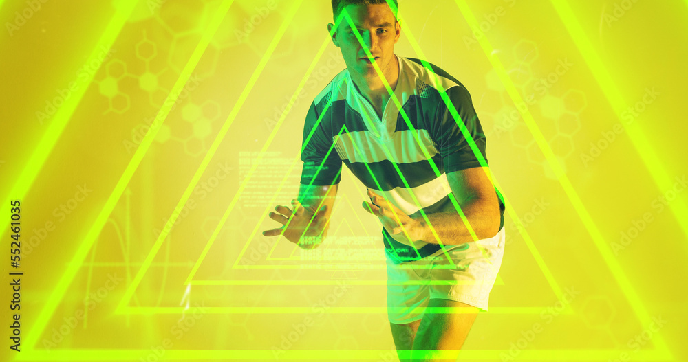 Poster caucasian rugby player standing over illuminated yellow triangles computer language and hexagon