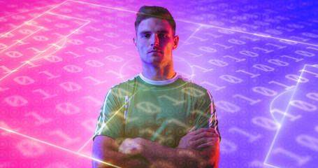 Portrait of confident caucasian sportsman with neon soccer field and binary codes in background
