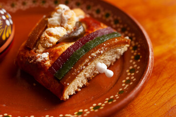 Slice of traditional rosca de reyes on a plate