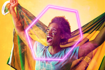 Obraz premium Hexagon neon over cheerful african american fan with flag celebrating victory during soccer match