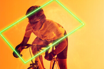 Rectangle neon over determined african american cyclist riding bicycle against yellow background