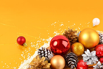 Christmas composition of balls and cones on a golden background