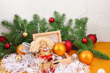 Christmas composition with handmade Christmas angel in a box