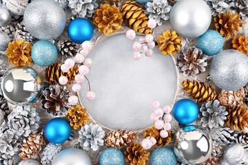 Christmas frame with blue balls and golden cones on a silver background