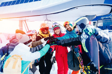 Happy group friends having fun resort background ski lift. Concept Sheregesh tour snowboarders team...