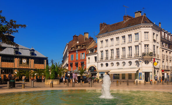 Cityscape of old French town of Sens with shops and outdoors cafe at summer
