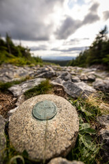 Marker indicating USA Canada border between Maine and Quebec