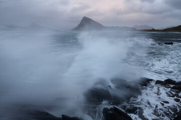 Waves crashing over coastline at Storsandnes, Lofoten Islands, Norway