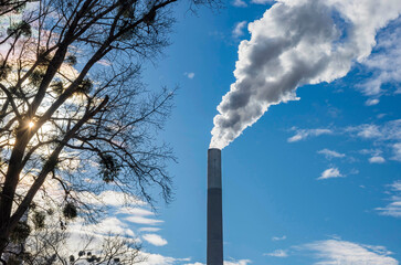 Industrial chimney, thermal power plant, pollution in the air, steam cooling tower in Graz, Styria...
