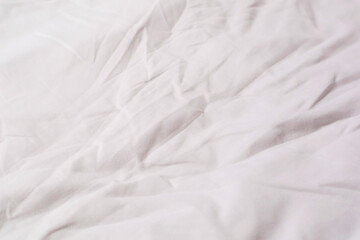 Fototapeta na wymiar Texture of white cotton crumpled fabric