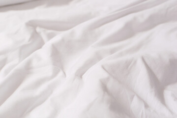 Texture of white cotton crumpled fabric
