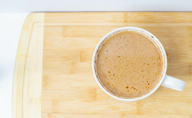 cup of coffee on wooden table