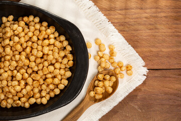 Chenopodium Quinoa - Caramelized Organic Quinoa Pop Seeds; Photo On Wooden Background.