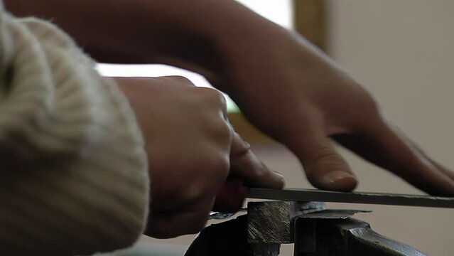 Hands of a High School Student Using Rasp At School Workshop. Close Up.  