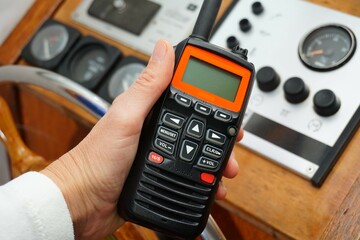 Handheld VHF held to transmit a message from the water and sea. For pleasure craft to call for help...