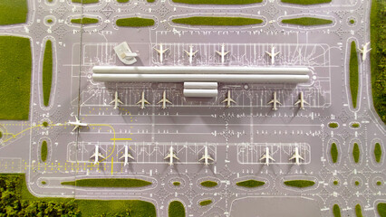 Realistic scale model of an airport runway view from above, with planes, trees, grass and signage....