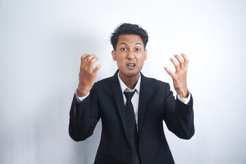 Angry man gesturing angrily raising hands and shouting loudly expressing anger after quarrel with boss or employee in suit isolated over white background. Feel my anger