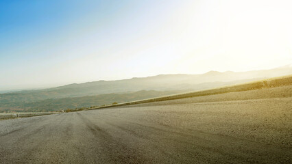 Asphalt road with green grass