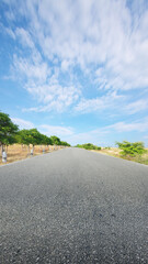 Asphalt road with green grass