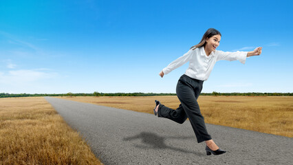 Fototapeta na wymiar Asian businesswoman running