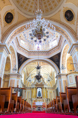 interior of a touristic mexican church covered with gold in Tlaxcalancingo, Puebla, Mexico,...