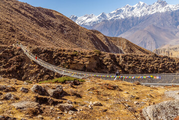 Suspension bridge on the Annapurna Circuit Trail in Nepal, Himalaya mountains