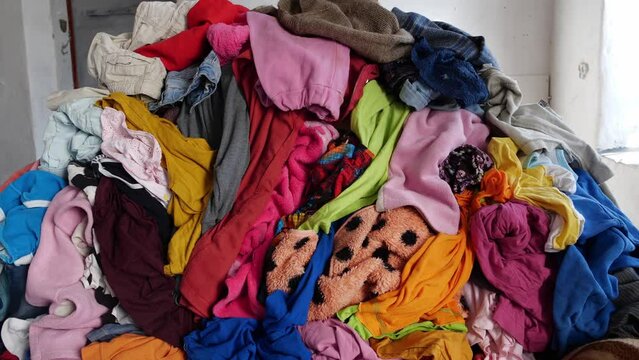 The Fashion Industry Waste. A bunch of old used unfashionable clothes