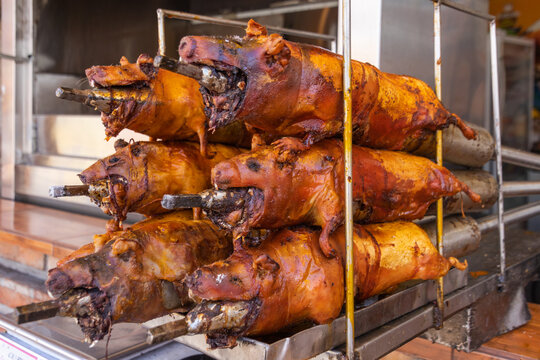 Guinea pigs (cuy) cooked on grill and ready for sale at the open market. Traditional food in Ecuador	