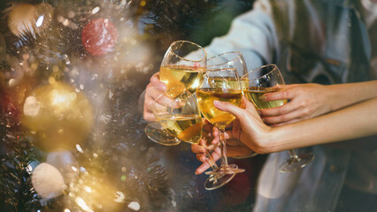 Cheer! A group of people or friends cheering for champagne and blessing with party background, celebration concept, media size banner, Focus at the glass.