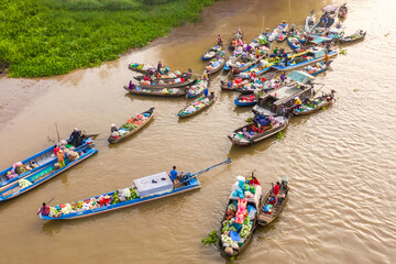 Fototapeta na wymiar Aerial view from above Phong Dien floating market on Tet holiday full of fruit and agricultural products