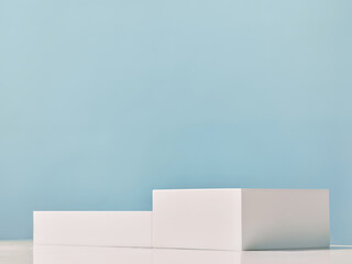 White podiums for product presentation on a blue background