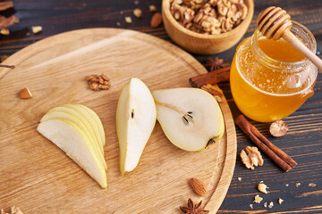 Ripe organic pear on the wooden cutting board Board at domestic kitchen