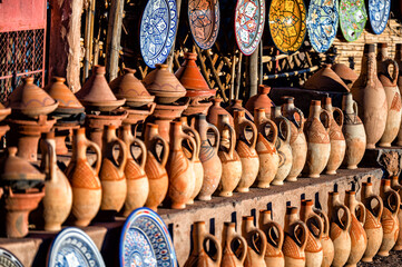 A set of traditional, handmade Moroccan clay dishes. Bowls, plates, tagines, jugs.