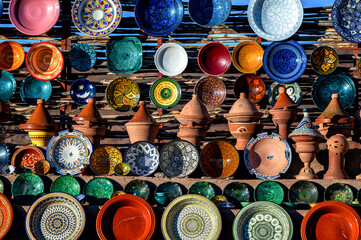 A set of traditional, handmade Moroccan clay dishes. Bowls, plates, tagines, jugs.