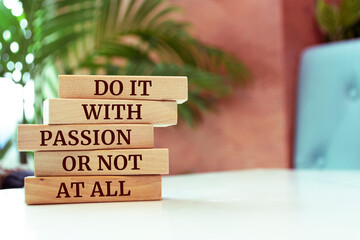 Wooden blocks with words 'Do It With Passion Or Not At All'.