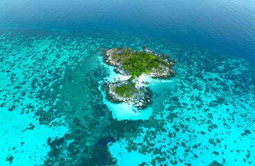 Fototapeta na wymiar The tropical with seashore island in a coral reef ,blue and turquoise sea Amazing nature landscape with blue lagoon-Above view