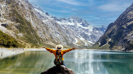 Happy young woman  look on the mountain landscape. Travel and active life concept  as Adventure...