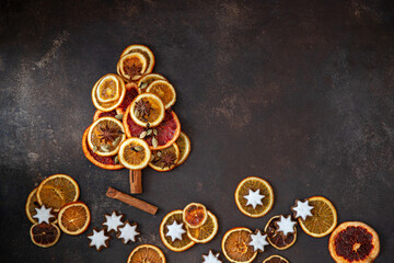 Christmas tree with dried fruits and  cookies    on wooden background