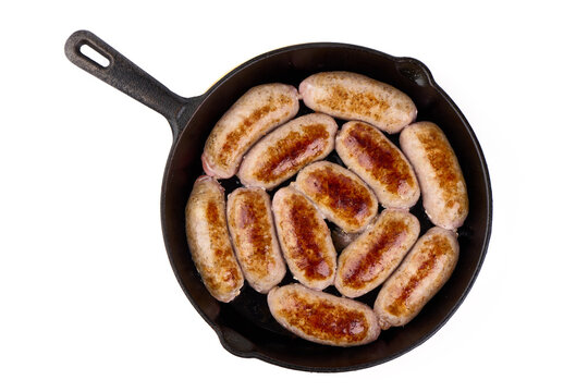 Grilled german bratwurst sausages in pan, isolated on white background.