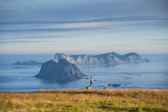 Hiker on Hellsegga plateau, Lofoten Islands, Norway